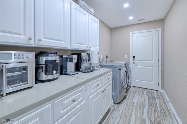 laundry area with baseboards, laundry area, a toaster, recessed lighting, and independent washer and dryer