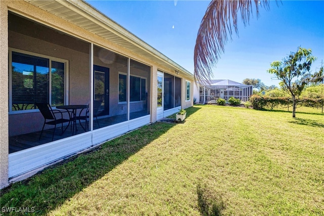 view of yard with a sunroom