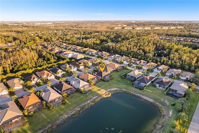 birds eye view of property with a residential view and a water view