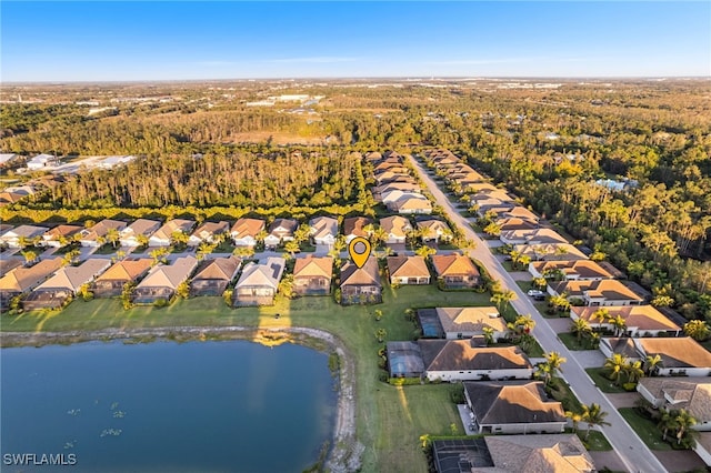 bird's eye view featuring a residential view and a water view