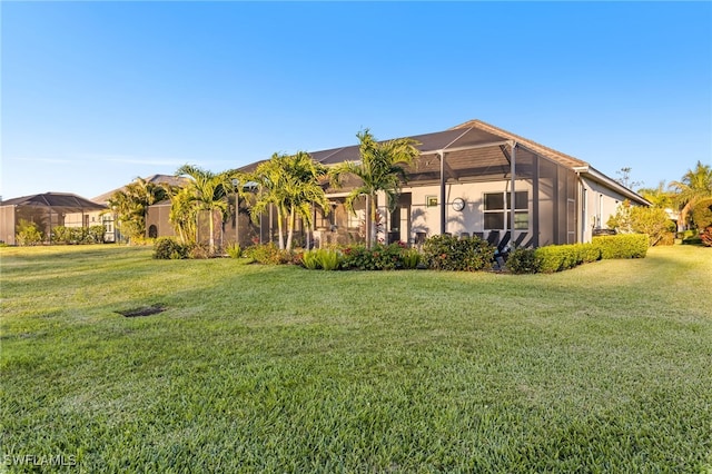 13589 Starwood Ln, Fort Myers, FL 33912 - view of front of house with a lanai and a front yard