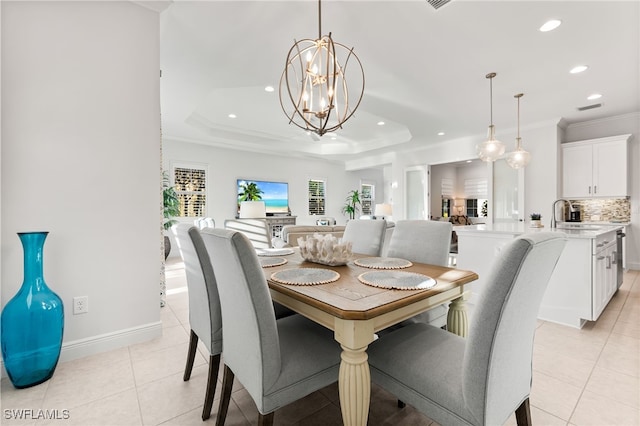 dining space featuring light tile patterned floors, recessed lighting, ornamental molding, a raised ceiling, and a notable chandelier