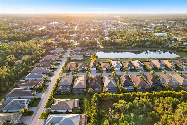 birds eye view of property featuring a residential view and a water view