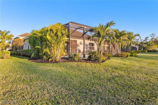 13589 Starwood Ln, Fort Myers, FL 33912 - exterior space featuring a lanai, a yard, and stucco siding