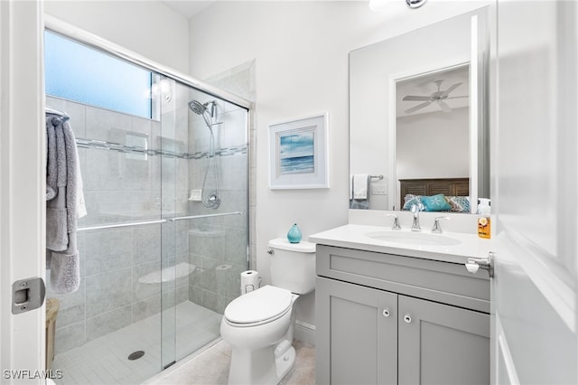 ensuite bathroom featuring connected bathroom, toilet, a stall shower, vanity, and a ceiling fan