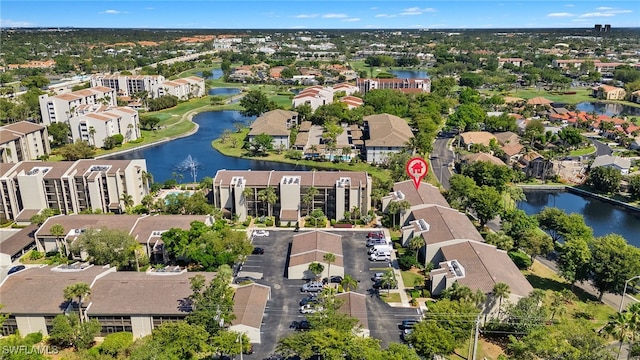 bird's eye view with a residential view and a water view