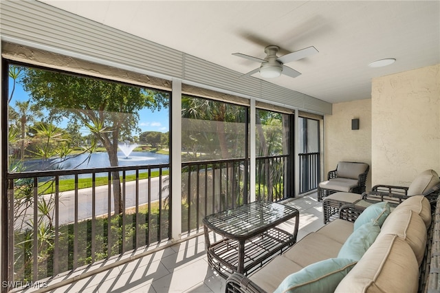 sunroom / solarium with a ceiling fan