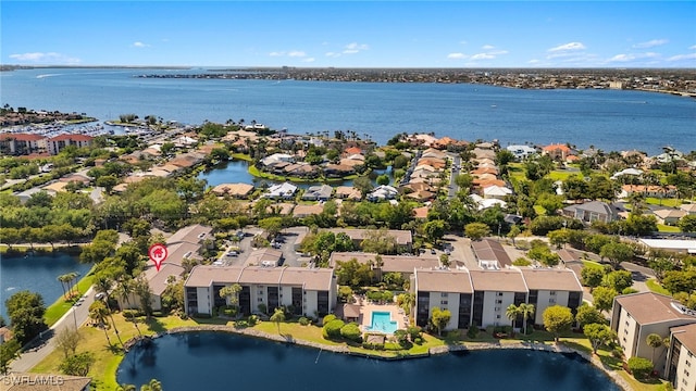 aerial view with a residential view and a water view