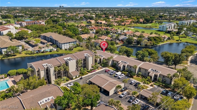 bird's eye view featuring a residential view and a water view