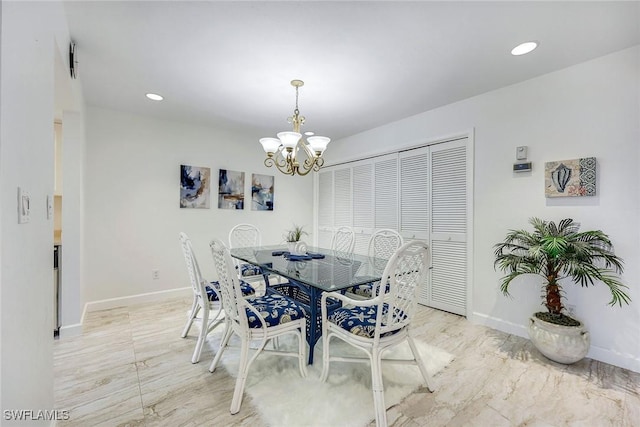 dining space with recessed lighting, baseboards, and a chandelier