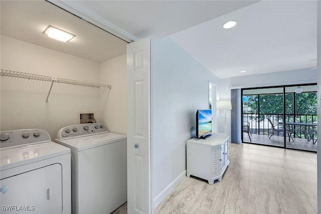 washroom with recessed lighting, baseboards, laundry area, and washing machine and clothes dryer