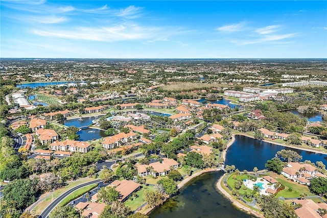 drone / aerial view with a residential view and a water view