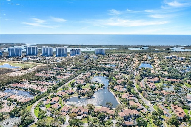 drone / aerial view featuring a water view and a residential view