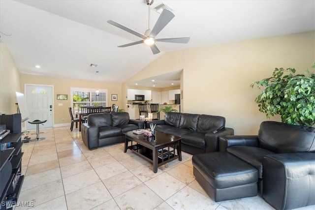 living area with visible vents, a ceiling fan, light tile patterned flooring, baseboards, and vaulted ceiling