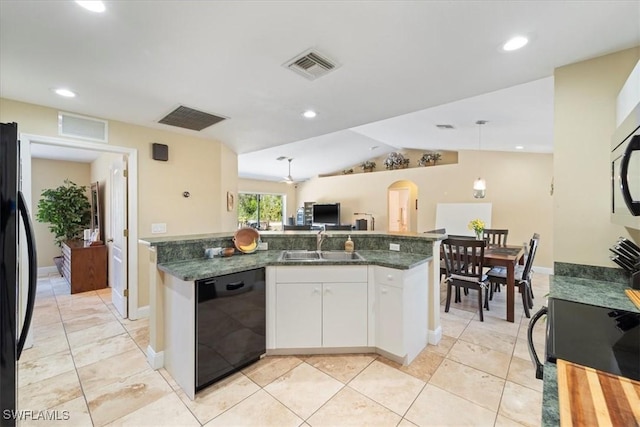 kitchen featuring black appliances, white cabinets, visible vents, and a sink