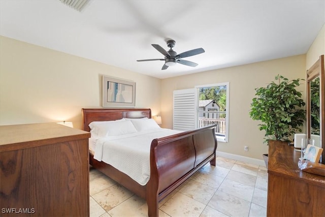 bedroom with baseboards and a ceiling fan