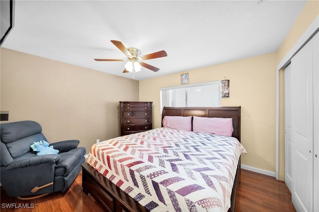 bedroom featuring a closet, ceiling fan, baseboards, and wood finished floors