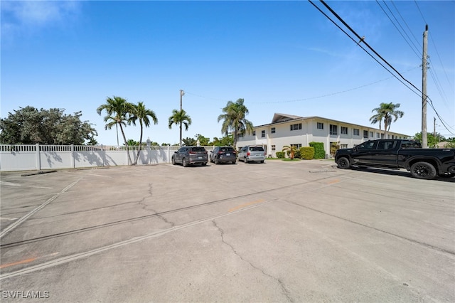 uncovered parking lot with fence