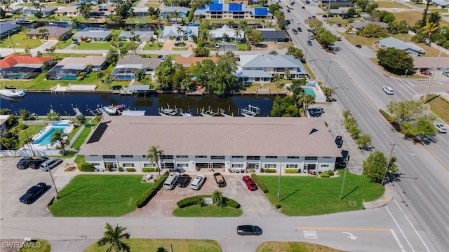 bird's eye view with a residential view and a water view