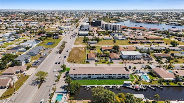 bird's eye view featuring a residential view and a water view