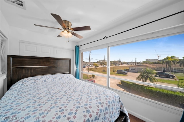 bedroom featuring visible vents and ceiling fan