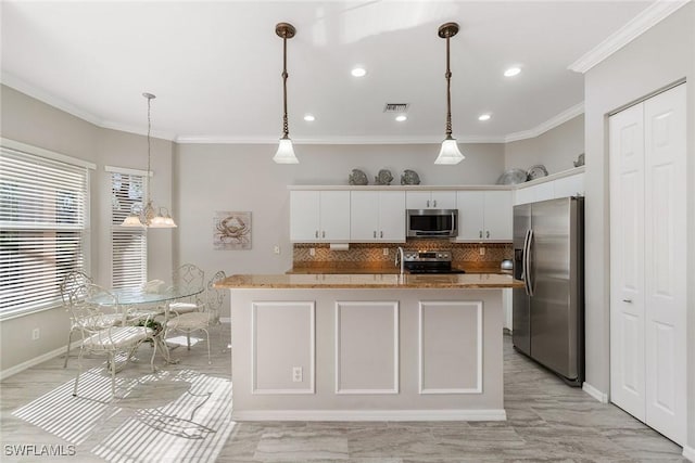 9011 Springview Loop, Estero, FL 33928 - kitchen featuring stainless steel appliances, ornamental molding, tasteful backsplash, baseboards, and white cabinetry
