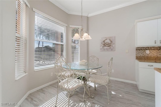 9011 Springview Loop, Estero, FL 33928 - dining area with a chandelier, ornamental molding, and baseboards