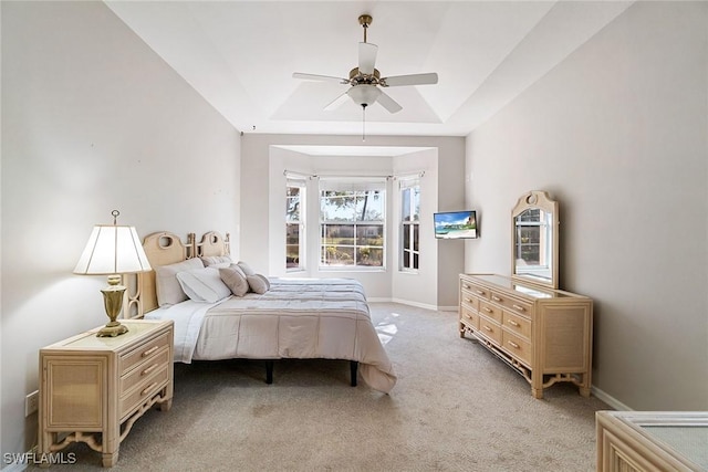 9011 Springview Loop, Estero, FL 33928 - bedroom featuring a tray ceiling, light carpet, baseboards, and ceiling fan