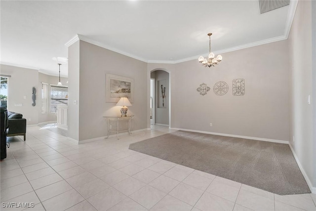 9011 Springview Loop, Estero, FL 33928 - unfurnished room featuring crown molding, arched walkways, a chandelier, and baseboards