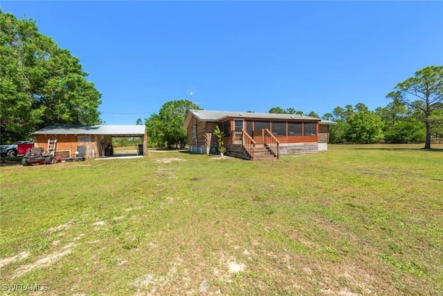 view of yard with a sunroom