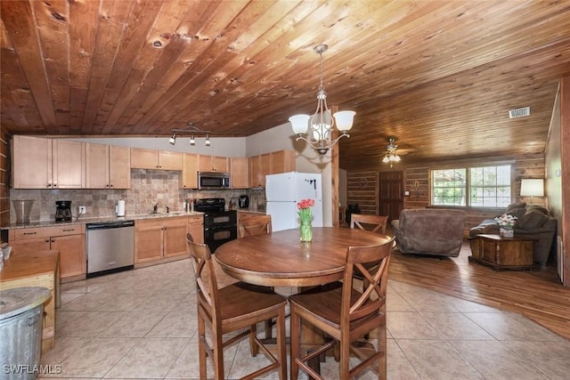 dining room with wooden ceiling, light tile patterned flooring, ceiling fan with notable chandelier, and visible vents