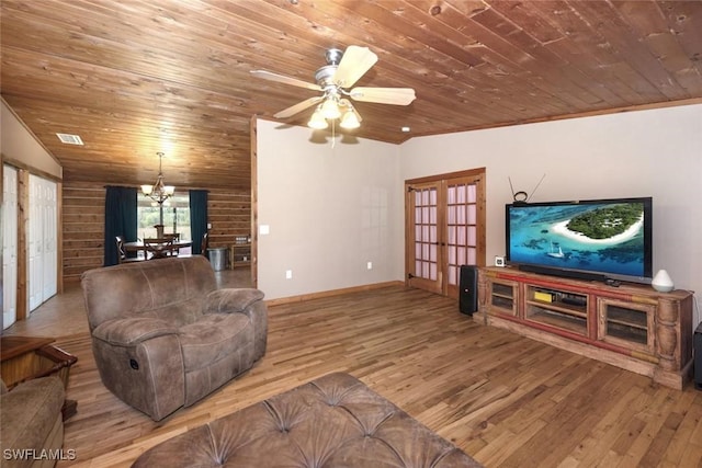 living area with wood finished floors, wood ceiling, french doors, and vaulted ceiling