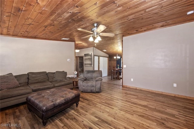 living room with ceiling fan with notable chandelier, wood finished floors, baseboards, wood ceiling, and vaulted ceiling