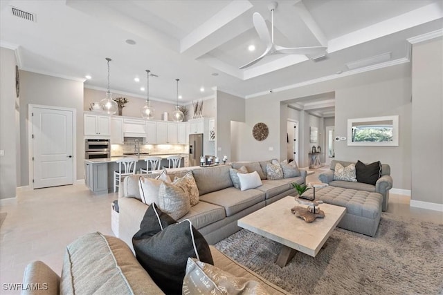 living area featuring crown molding, ceiling fan, baseboards, beamed ceiling, and recessed lighting