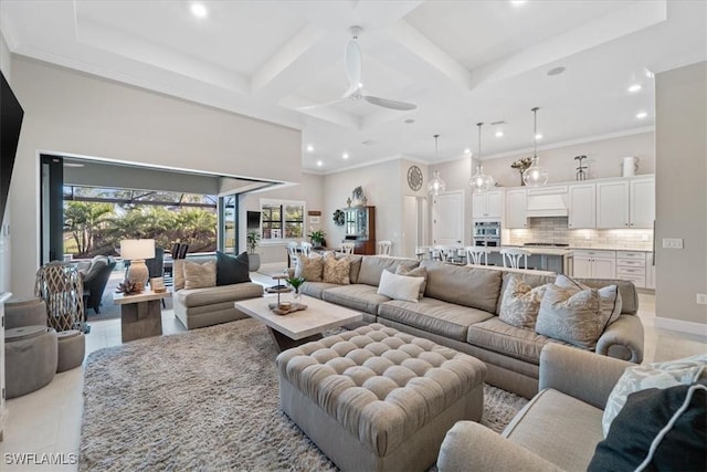 living room featuring crown molding, light tile patterned floors, a high ceiling, coffered ceiling, and a ceiling fan