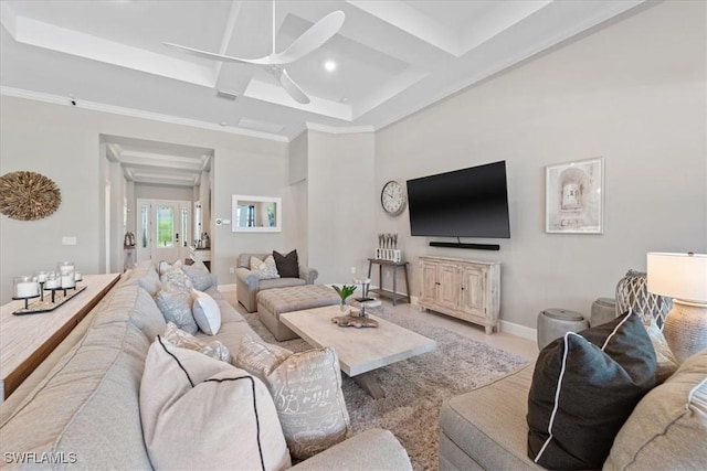 living area featuring coffered ceiling, baseboards, ceiling fan, and ornamental molding