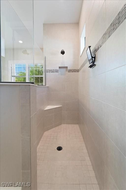 full bathroom with tiled shower