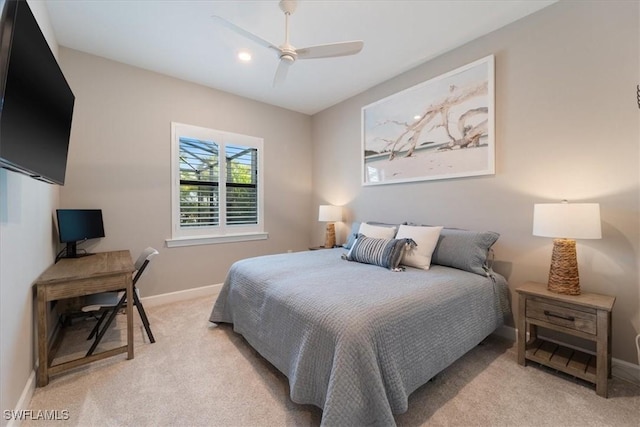 bedroom with baseboards, light carpet, and ceiling fan