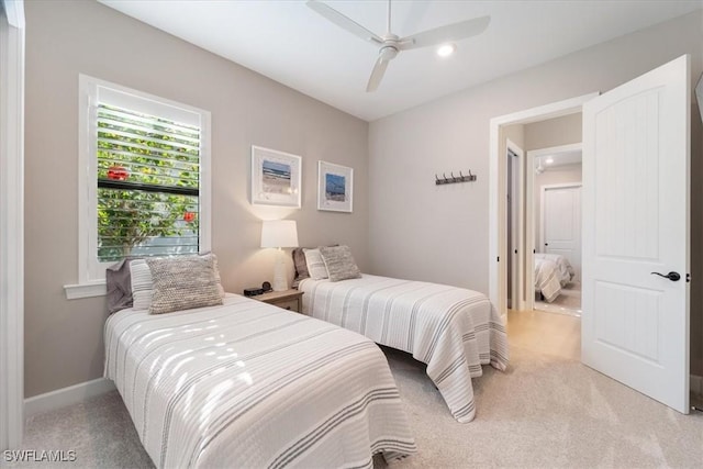 bedroom featuring recessed lighting, baseboards, light carpet, and a ceiling fan