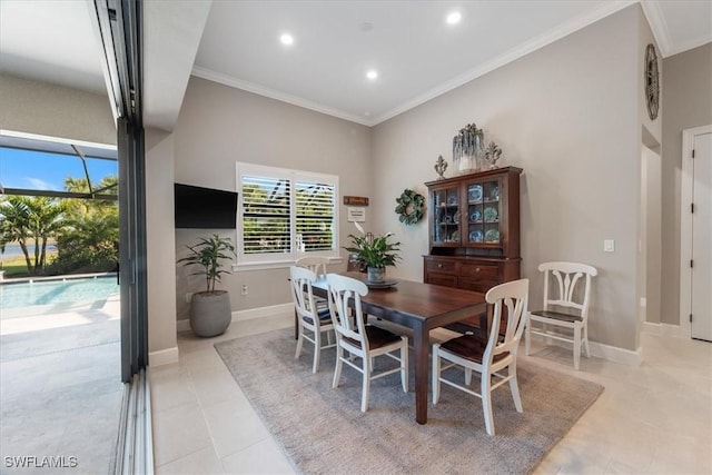 dining space with recessed lighting, baseboards, ornamental molding, and light tile patterned flooring