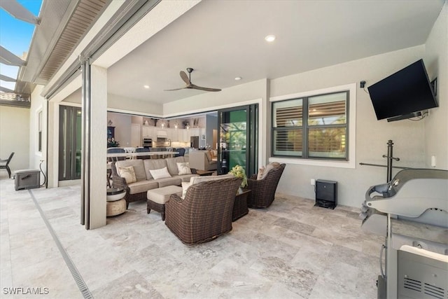 view of patio with outdoor lounge area and ceiling fan