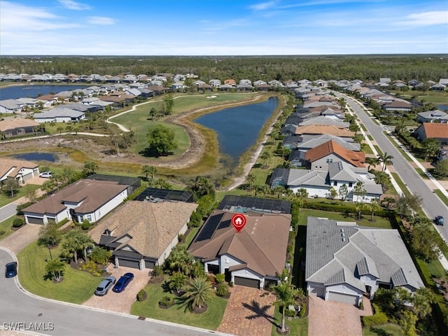 aerial view with a water view and a residential view