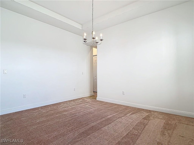 unfurnished room featuring baseboards, an inviting chandelier, and carpet flooring