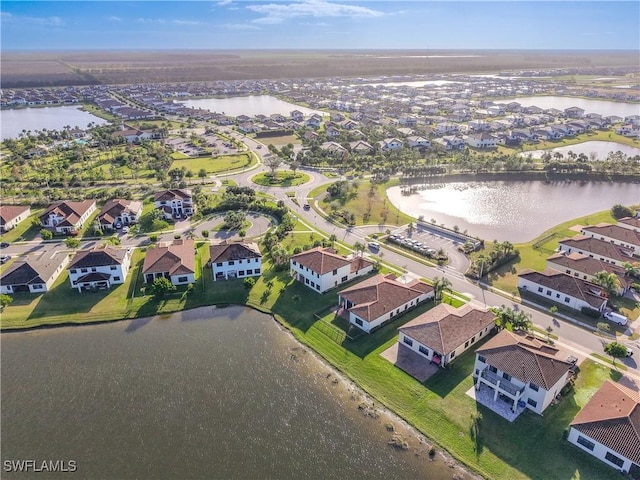 bird's eye view featuring a residential view and a water view