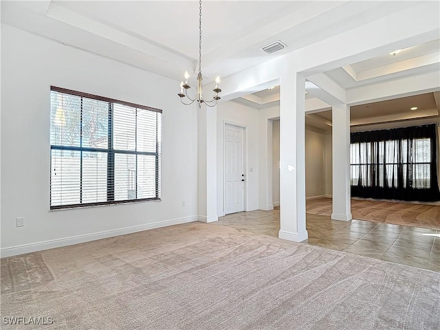 tiled spare room featuring baseboards, visible vents, an inviting chandelier, a tray ceiling, and carpet flooring