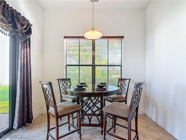 dining area featuring baseboards