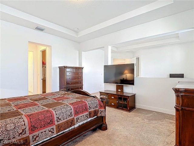 bedroom with visible vents, baseboards, carpet, and a tray ceiling