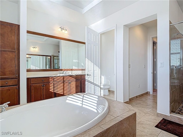 bathroom with tile patterned flooring, toilet, tiled tub, and a stall shower