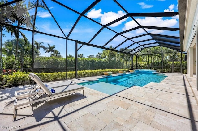 pool with a patio area, an in ground hot tub, and a lanai