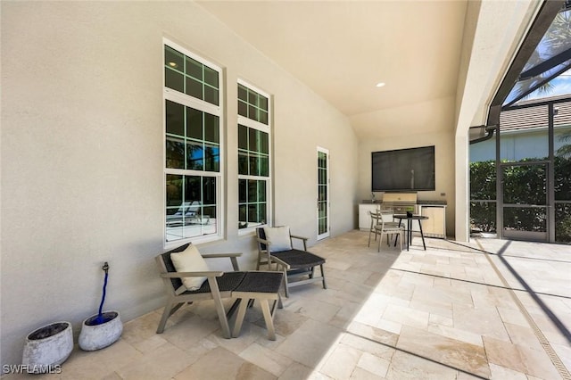 view of patio / terrace with a lanai